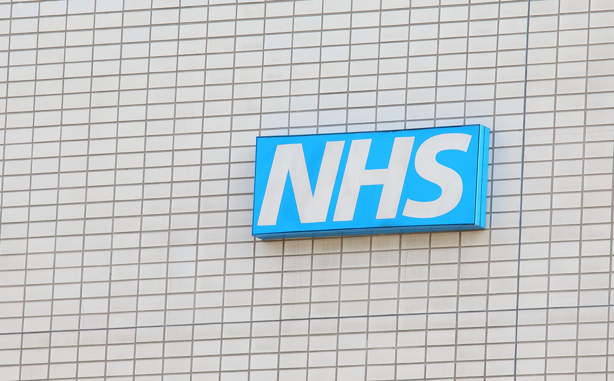 NHS sign on wall