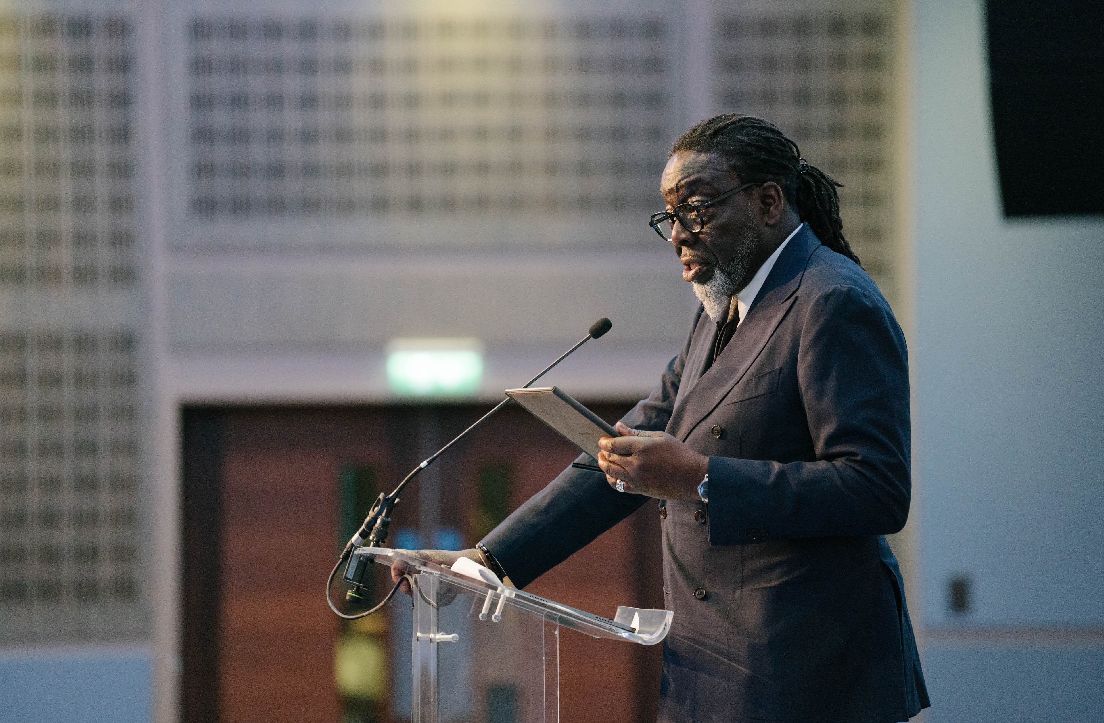 Lord Victor Adebowale speaking at a podium
