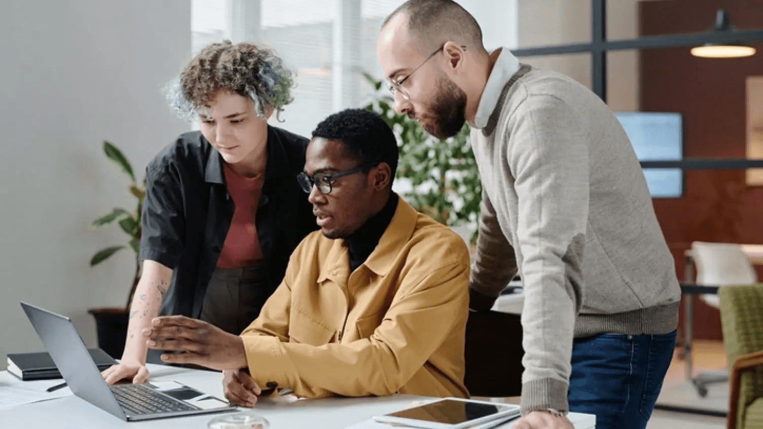 Colleagues at a computer.