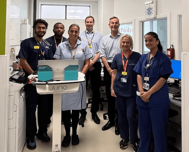 Daniel Elkeles, chief executive of NHS Providers standing with six members of the team at Leicester 