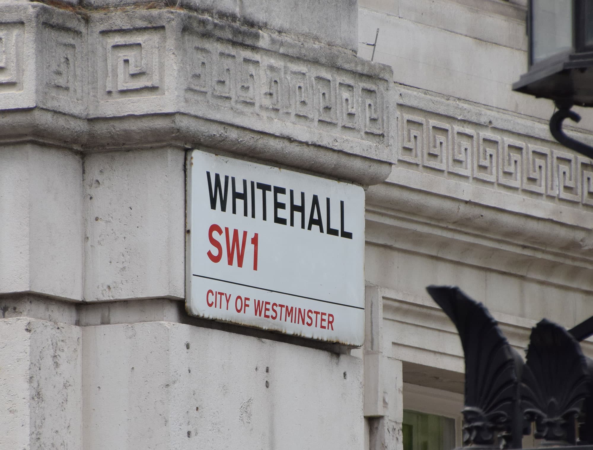 Street sign displaying Whitehall SW1