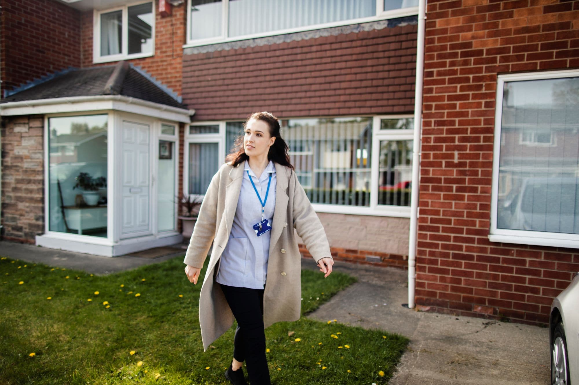 A commuunity health visitor leaving a home visit